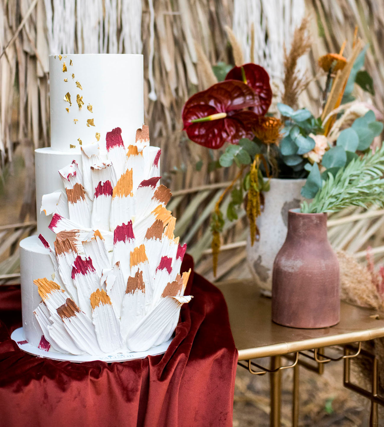 The wedding cake was decorated with colorful brushstrokes