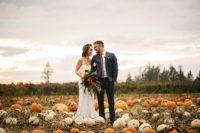 10 The couple went to a pumpkin field for the wedding portraits