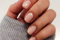 10 blush wedding nails and shiny glitter beads that accent the ring finger are great for a any modern bride