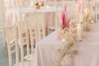 11 The wedding venue was done in pink and blush, with pretty blooms, candles and herbs