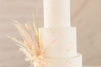 an awesome wedding cake in neutral tones