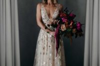 17 a blush thick strap wedding dress with foil stars and a plunging neckline plus a crystal crown for a celestial bride