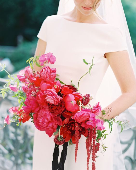 a bold fuchsia wedding bouquet with amaranthus and some textural greenery plus black ribbons