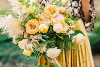 a gold wedding bouquet with roses and peonies, some greenery and fluffy touches for the fall