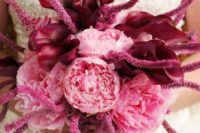 a pink wedding bouquet with deep purples is a very catchy and bold color statement to try