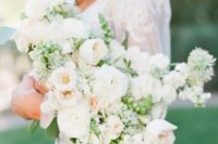 a tender and soft wedding bouquet with touches of greenery is a refrshing idea for a spring bride