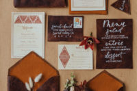 02 The wedding invitation suite was done with brown leather and amber touches, with velvet ribbons