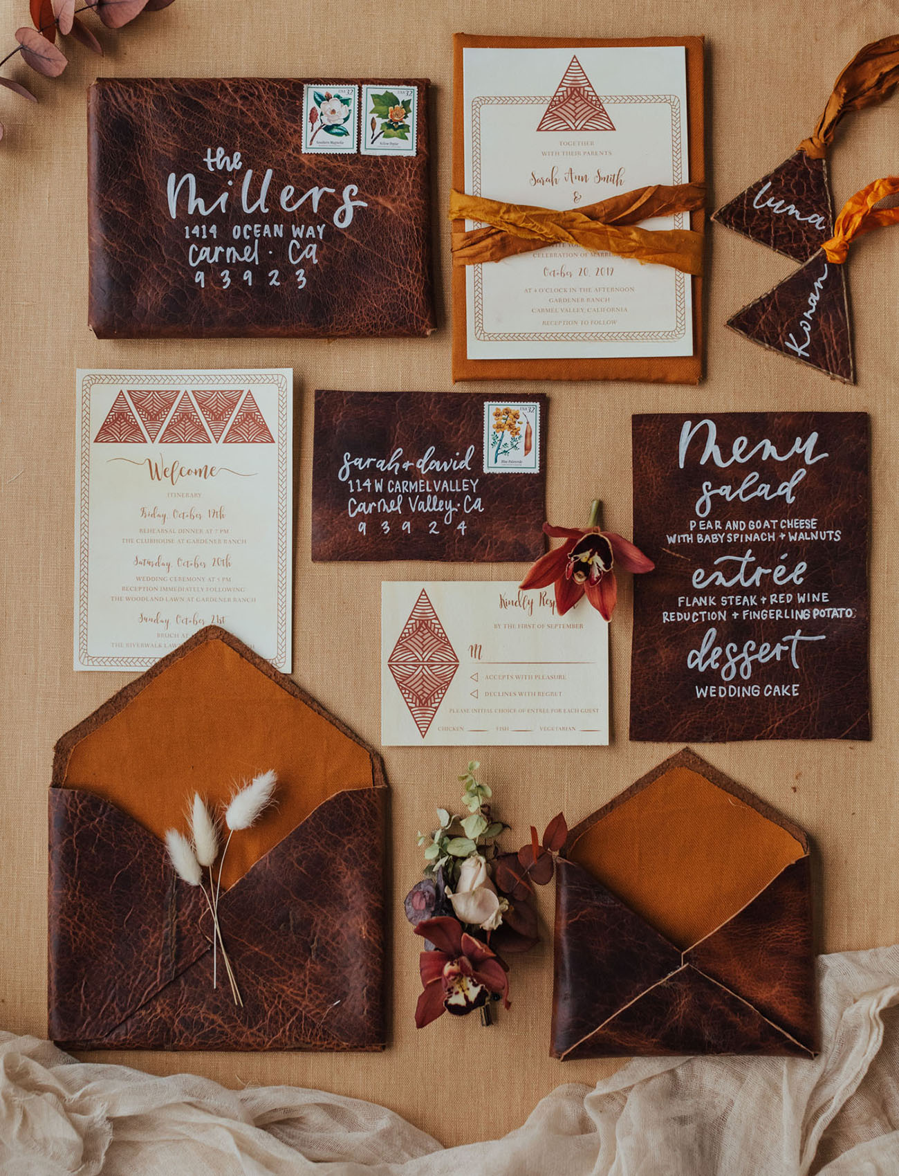 The wedding invitation suite was done with brown leather and amber touches, with velvet ribbons