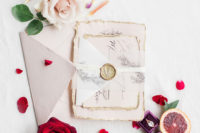 02 The wedding stationery was done in neutrals and blush, with a raw hem and some vegetation painted