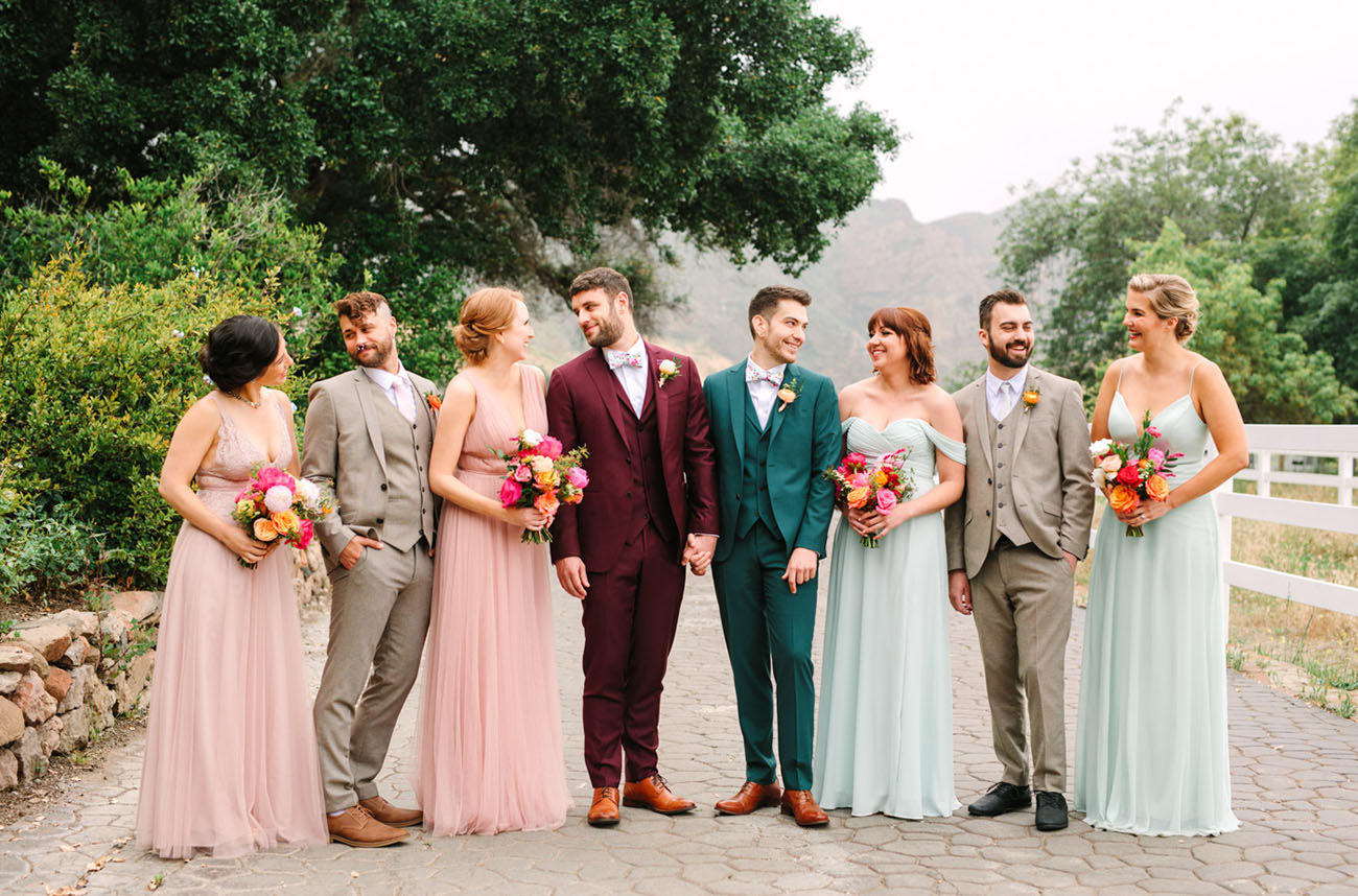 The bridesmaids were wearing pastel pink and green mismatched dresses