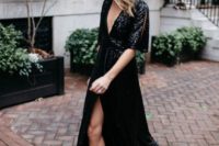 03 a black sequin wrap maxi dress with a deep neckline, cutout sleeves and black ankle strap shoes for a wow effect