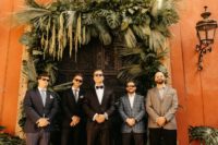 05 The groom was wearing a black tux and the groomsmen were rocking mismatching suits and looks