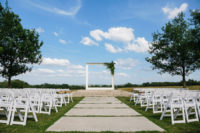 06 The ceremony space was done minimalist, with white chairs, an oversized frame with fronds on one corner