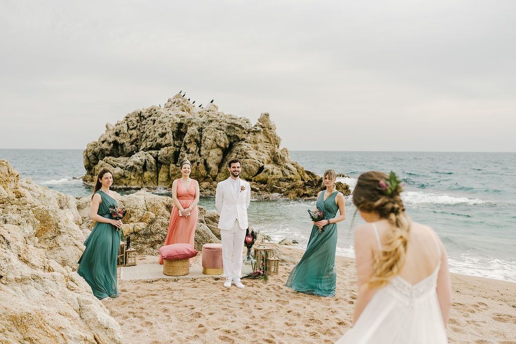 The ceremony space was right on the beach, with a chic lounge   stools and candle lanterns