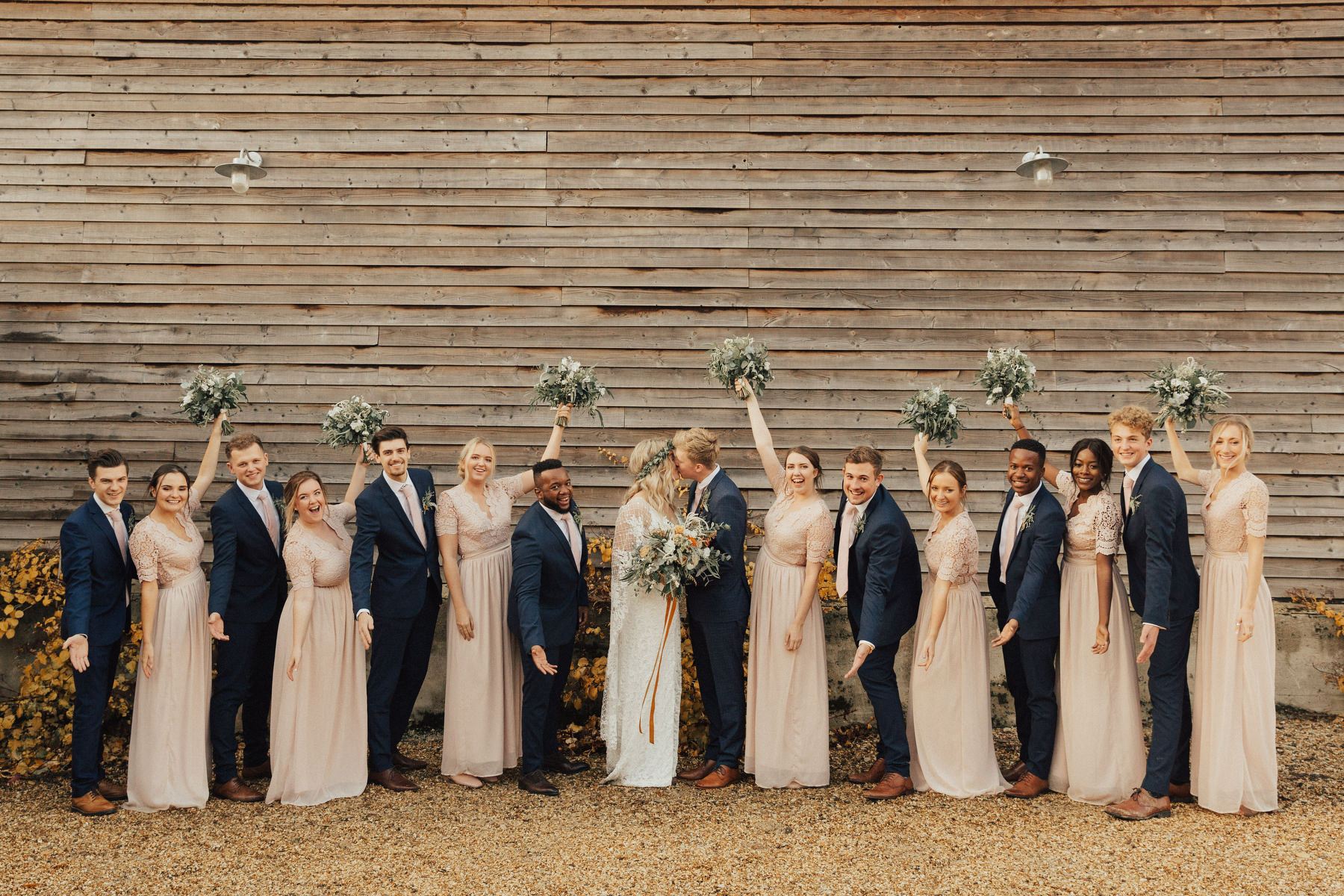 The groomsmen were wearing navy suits with blush ties just like the groom