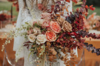 08 The gorgeous bridal bouquet was done with dried and fresh foliage, bold blooms and long ribbons