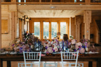 09 The wedding reception strikes with lush florals at once, and deep colored candles complete the look