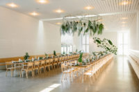 10 The reception space was done with uncovered tables, fronds and leaves and white porcelain for a minimal feel