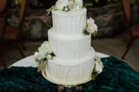10 The wedding cake was a white textural one, with neutral blooms