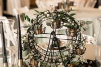 Such quirky wheel centerpieces with greenery were also incorporated into decor