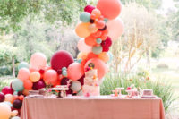 11 The dessert table was accented with a gorgeous colorful balloon arch behind it