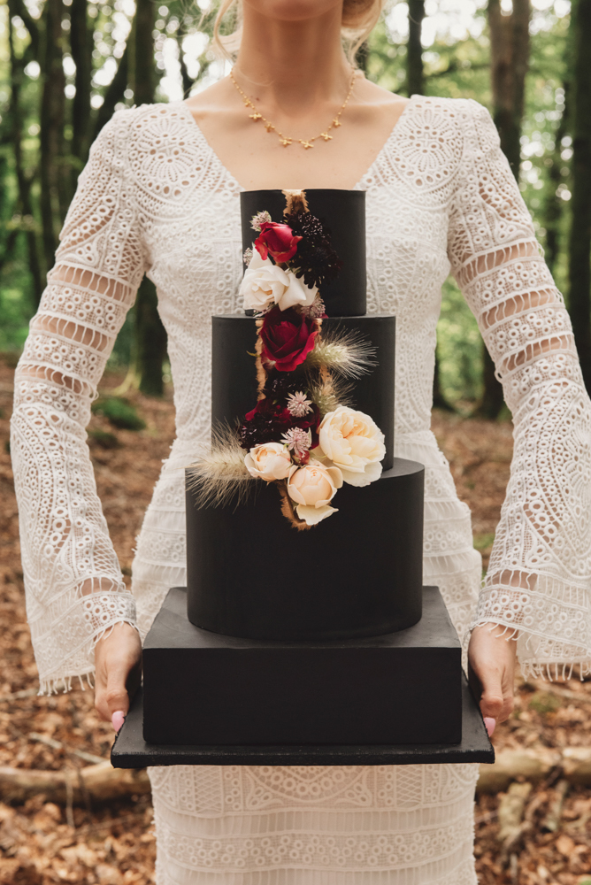 The wedding cake was a black one, with bold and neutral blooms and a bit of gold