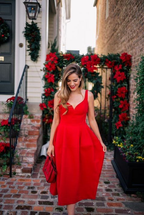 a red A-line midi dress with thick straps, a mini red bag and a red lipstick for a wow look