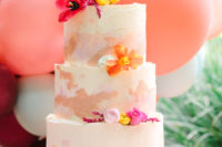 12 The wedding cake was a bright watercolor one, with brushstrokes and bright blooms