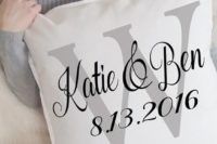 16 a personalized pillow with the wedding or engagement date and the names of the couple is a stylish and simple idea