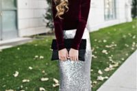 23 a deep purple velvet top with long sleeves, a silver sequin maxi skirt and a black clutch for a breathtaking look