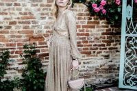 a glam sparkling gold maxi dress with long sleeves, metallic heels and a cute blush bag are pure elegance