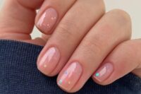 a nude wedding manicure with colorful polka dots is a very cute, fresh and fun manicure for a wedding