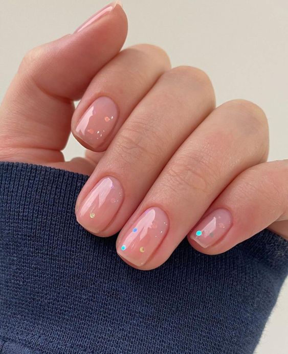 a nude wedding manicure with colorful polka dots is a very cute, fresh and fun manicure for a wedding
