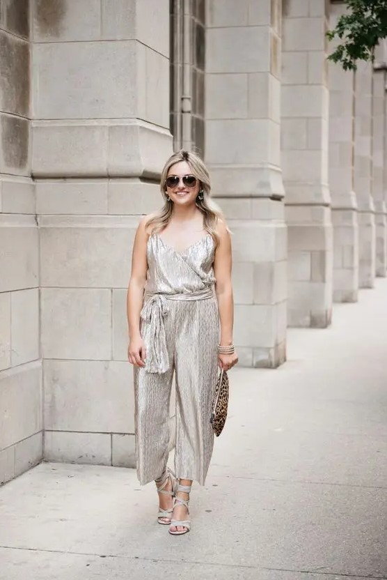 a silver jumpsuit with sashes, strappy heels and a leopard print clutch for a bold look