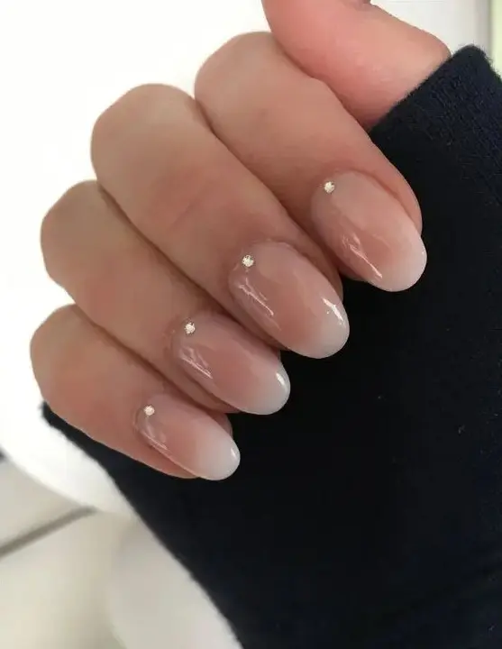 ombre French nails with little rhinestones is a chic and modern idea for an edgy bride