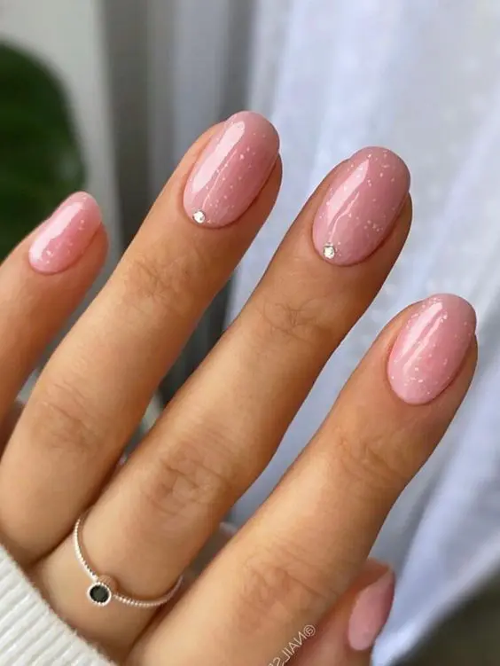 pink glitter nails with tiny rhinestones are amazing for a wedding, they look very girlish and cute
