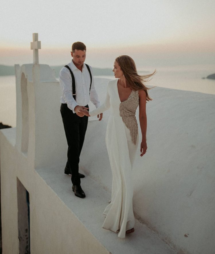 This magical Santorini wedding was done with tropical florals, lots of lights and Santorini magic