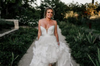 02 The bride was wearing a fantastic custom-made wedding dress with a plunging neckline, a feather skirt and booties