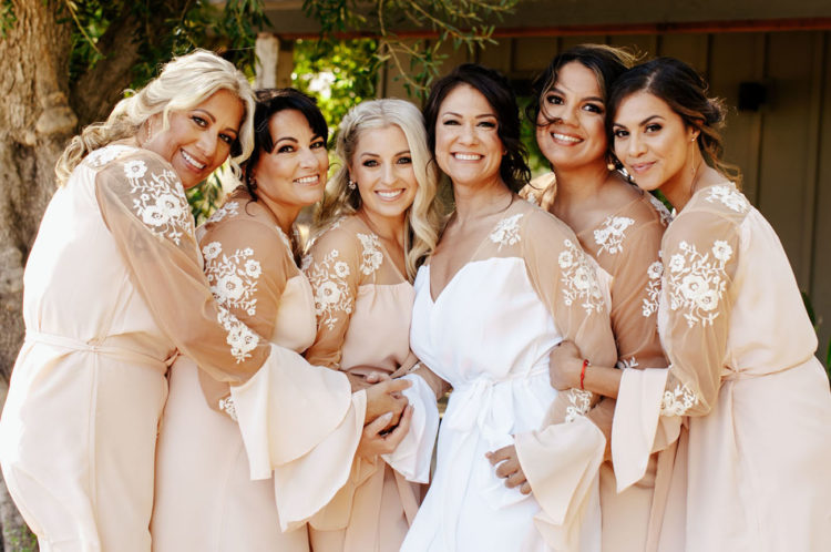 The bridesmaids and gals were getting ready in very chic robes with lace appliques