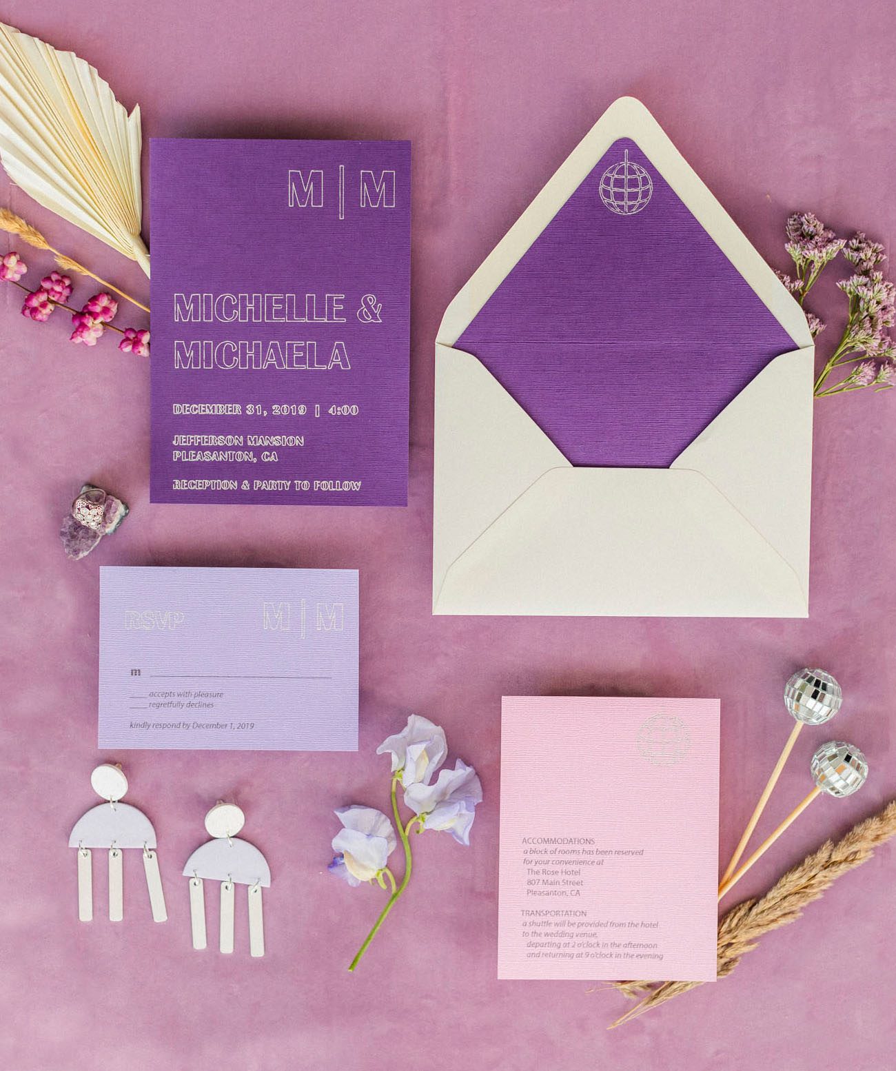 The wedding invitation suite was done in purple, lilac and neutrals