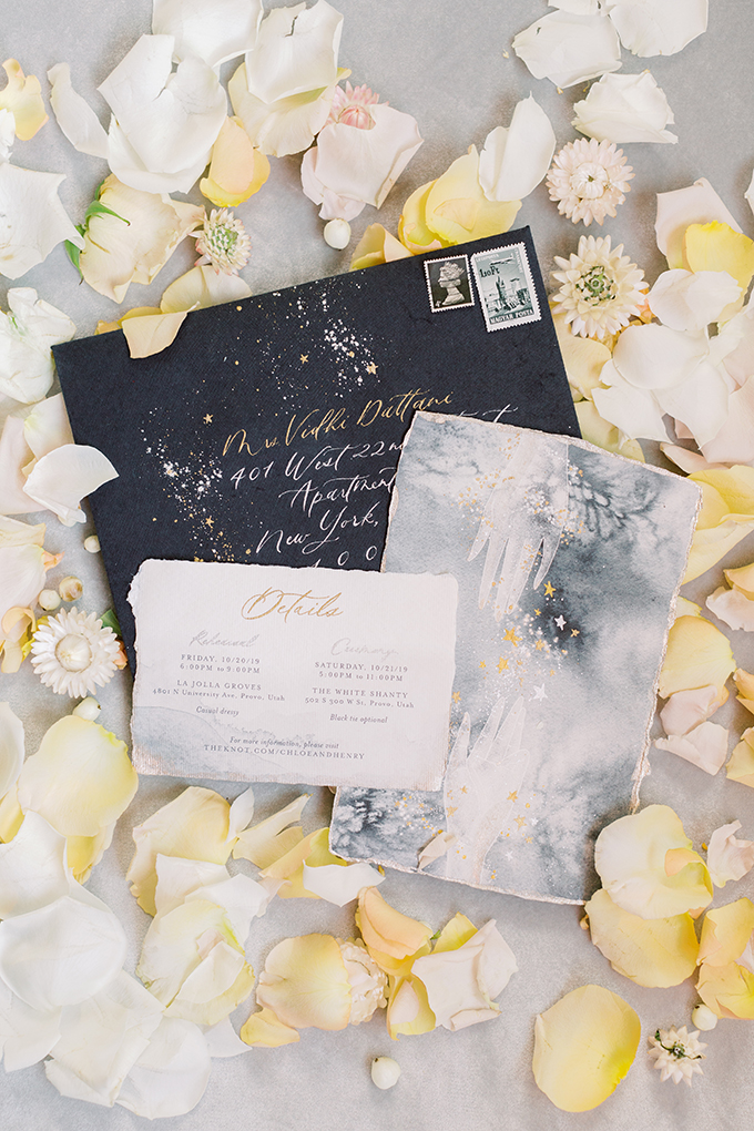 The wedding stationery was done in black, grey and neutrals, with elegant calligraphy and a raw edge