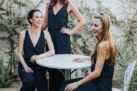 03 stylish and simple navy modern jumpsuits with deep V-necklines and black heels for modern bridesmaids