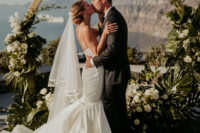 04 The bride was wearing a strapless mermaid wedding dress with a veil and a train, the groom rocked a classic black tux