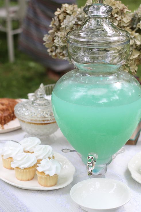 aqua-colored lemonade in a large tank is a cool idea to add a trendy shade to your wedding