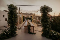 07 The reception was done with tropical greenery and white blooms and lots of fairy lights