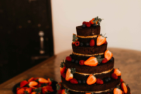 09 The naked chocolate wedding cake was done with fresh berries and looked super yummy