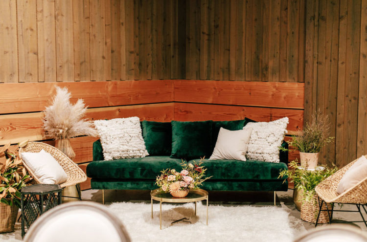 The wedding lounge was done with pampas grass, wicker furniture and gold touches