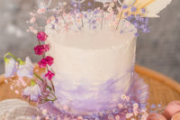 12 The wedding cake was an ombre lilac one, decorated with numbers and blooms