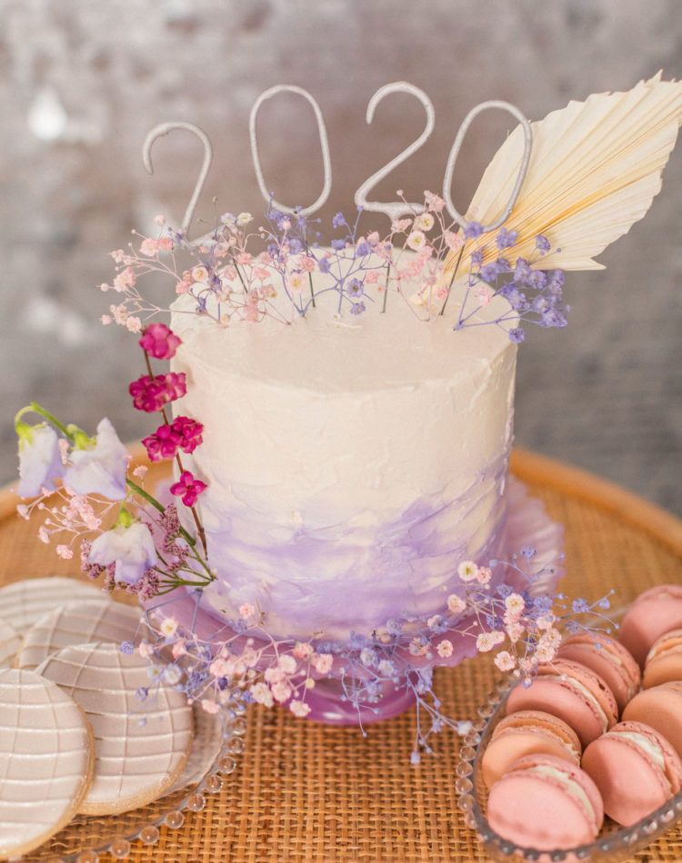 The wedding cake was an ombre lilac one, decorated with numbers and blooms