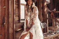 15 a cowboy hat and cowboy boots plus a bolo tie over a heavenly beautiful lace wedding dress